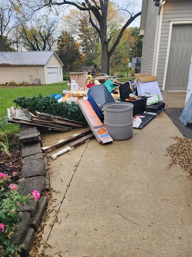 Dumpster being loaded with debris for 3 Yard Dumpster Rental in Hamburg